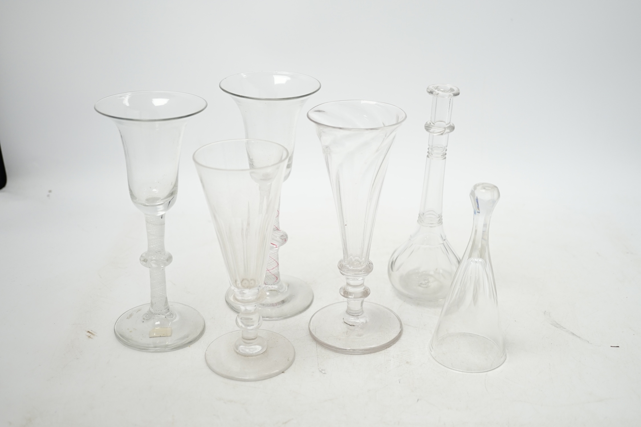 Two 18th century Dutch wine glasses, colour twist and opaque twist stems, two ale glasses, a toddy lifter and a stirrup cup, tallest 16.5cm. Condition - good